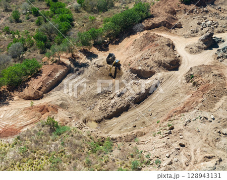Machines work loading sand from quarry 128943131