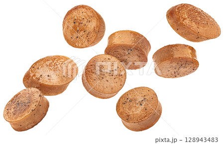 Falling fried sausage slices isolated on white background with clipping path Falling fried sausage slices isolated on white background with clipping path 128943483