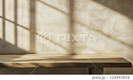 Sunlight and window shadow on white wall and wooden table surface, copy space Sunlight and window shadow on white wall and wooden table surface, copy space 128943658