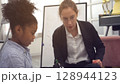 African kid with caucasian teacher diversity fun interactive learning environment school 128944123
