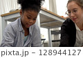 African kid with caucasian teacher diversity fun interactive learning environment school 128944127