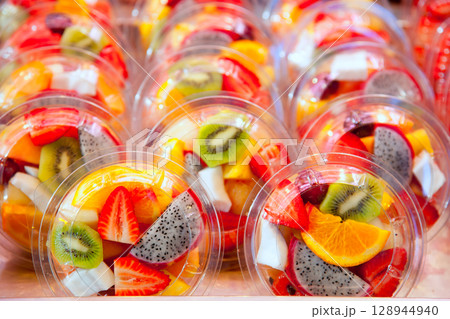 Colorful fruit salad in transparent glasses 128944940