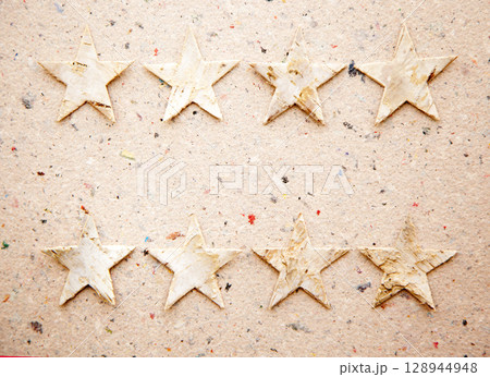 christmas stars on recycled paper background christmas stars on recycled paper background 128944948
