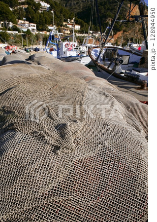 Fishing net and gear for professional fisherman boat 128944950
