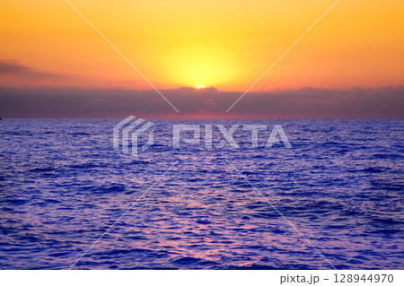 Mediterranean sea sunrise with orange sky 128944970