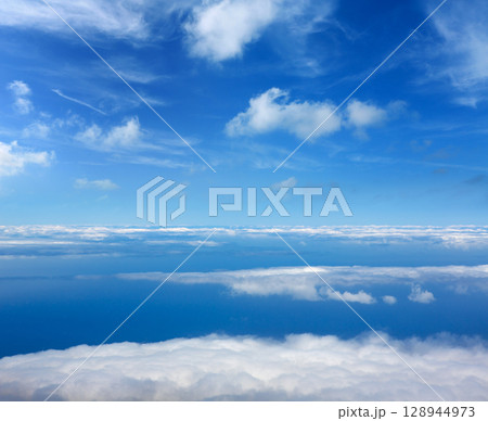 Blue sky sea of clouds from high altitude Blue sky sea of clouds from high altitude 128944973