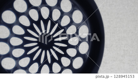 Round perforated pattern similar to the design of an aircraft turbine Round perforated pattern similar to the design of an aircraft turbine 128945153
