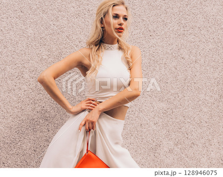 Woman wearing crop top and culottes Woman wearing crop top and culottes 128946075