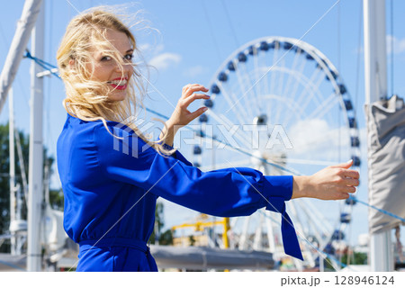 Fashion model and ferris wheel 128946124
