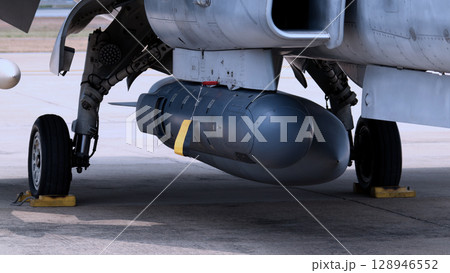 Close up of modern aircraft military fighter jet. Close up Jet parts such as landing gear engine nacelles weapon pods and cockpit with visible pilots showing defense technology and aircraft design. 128946552
