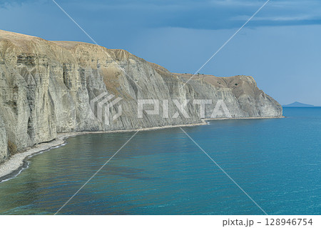 Stunning Coastal Cliffs Along the Serene Blue Waters of a Cape Bugaz 128946754