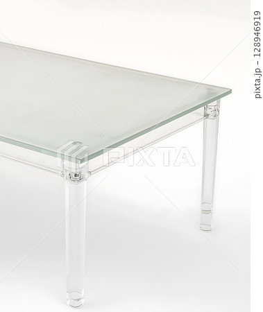 A clear glass table with a white background A clear glass table with a white background 128946919