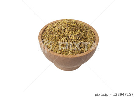 dried flowers of black lilac or black elder in latin sambuci flos in wooden bowl isolated on white background.Herbs. Alternative medicine. 128947157