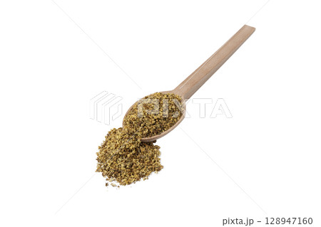 dried flowers of black lilac or black elder in latin sambuci flos on wooden spoon isolated on white background.  Herbs. Alternative medicine. 128947160