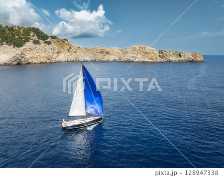 Aerial view of beautiful sailboat. Boat on the sea in summer 128947338