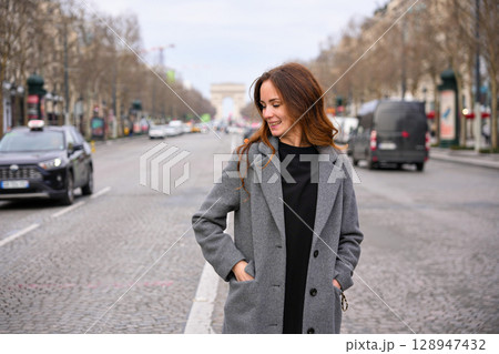Woman smiling on street in Paris Woman smiling on street in Paris 128947432