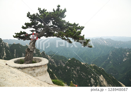 Mount Huashan is one of the most famous tourist attractions in China and one of the must-do activities is rock climbing and hiking. It is a sacred mountain, home to many deities. 128948087