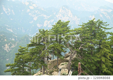 Mount Huashan is one of the most famous tourist attractions in China and one of the must-do activities is rock climbing and hiking. It is a sacred mountain, home to many deities. 128948088