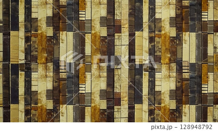 A vintageinspired pattern featuring rows of grainy rectangles in varying shades of browns and yellows creating the illusion of a classic film reel 128948792