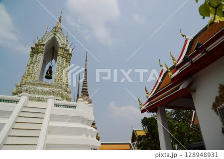 Classic Thai architecture with pagoda in Wat Phra Chetuphon or Wat Pho. Which is one of the largest and oldest temples and is popular with both Thai and foreign tourists. Located at Bangkok city. Classic Thai architecture with pagoda in Wat Phra Chetuphon or Wat Pho. Which is one of the largest and oldest temples and is popular with both Thai and foreign tourists. Located at Bangkok city. 128948931