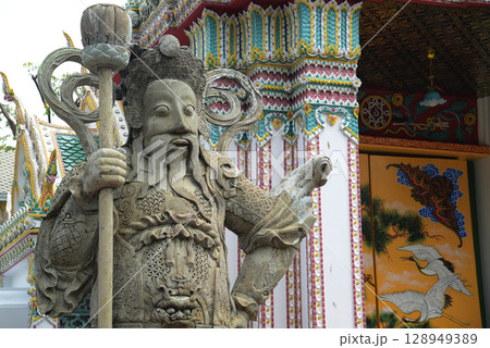 Chinese guardian statue at the gate of Wat Pho Which is one of the largest and oldest temples in Bangkok and is popular with both Thai and foreign tourists. Chinese guardian statue at the gate of Wat Pho Which is one of the largest and oldest temples in Bangkok and is popular with both Thai and foreign tourists. 128949389