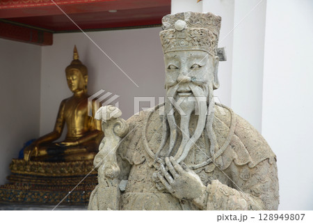 Chinese warrior statues decorate the covered chapel with Buddha statues at the back of Wat Pho, a popular place for both Thai and international tourists. Chinese warrior statues decorate the covered chapel with Buddha statues at the back of Wat Pho, a popular place for both Thai and international tourists. 128949807