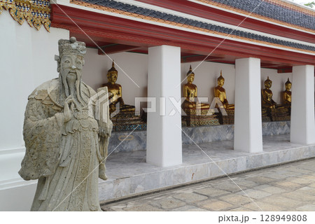 Chinese warrior statues decorate the covered chapel with Buddha statues at the back of Wat Pho, a popular place for both Thai and international tourists. Chinese warrior statues decorate the covered chapel with Buddha statues at the back of Wat Pho, a popular place for both Thai and international tourists. 128949808