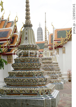 Classic Thai architecture with pagoda in Wat Phra Chetuphon or Wat Pho. Which is one of the largest and oldest temples and is popular with both Thai and foreign tourists. 128950141