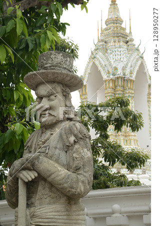 Chinese guardian statue at the gate of Wat Pho Which is one of the largest and oldest temples in Bangkok and is popular with both Thai and foreign tourists. Chinese guardian statue at the gate of Wat Pho Which is one of the largest and oldest temples in Bangkok and is popular with both Thai and foreign tourists. 128950277