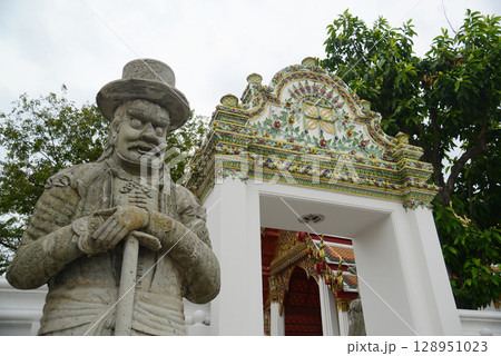 Chinese guardian statue at the gate of Wat Pho Which is one of the largest and oldest temples in Bangkok and is popular with both Thai and foreign tourists. Chinese guardian statue at the gate of Wat Pho Which is one of the largest and oldest temples in Bangkok and is popular with both Thai and foreign tourists. 128951023