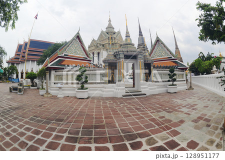 Beautiful Thai architecture of pagoda and building at Wat Phra Chetuphon or Wat Pho, which is an important temple, is large and has many Buddhists and tourists visiting. At Bangkok city in Thailand. Beautiful Thai architecture of pagoda and building at Wat Phra Chetuphon or Wat Pho, which is an important temple, is large and has many Buddhists and tourists visiting. At Bangkok city in Thailand. 128951177