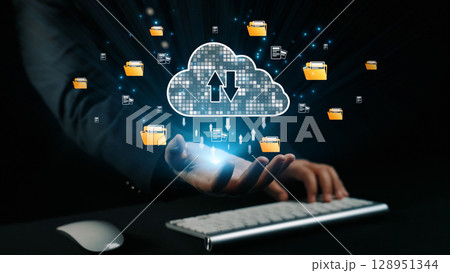 Hand Reaching for Cloud Storage with Digital Files and Folders Representing Data Transfer and Technology Innovation Concept in Dark Background. Qubit 128951344