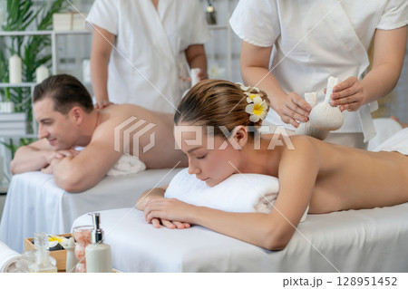 Hot herbal ball spa massage body treatment at day spa . Quiescent Hot herbal ball spa massage body treatment at day spa . Quiescent 128951452