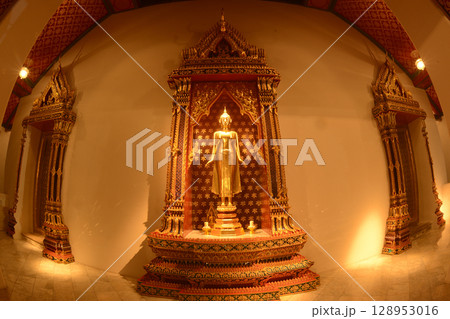 The standing Buddha statue is made of bronze and is enshrined in Wat Phra Chetuphon Wimonmangklaram or Wat Pho is popular with both Thai and foreign tourists. Located at Bangkok city in Thailand. The standing Buddha statue is made of bronze and is enshrined in Wat Phra Chetuphon Wimonmangklaram or Wat Pho is popular with both Thai and foreign tourists. Located at Bangkok city in Thailand. 128953016