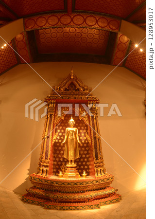 The standing Buddha statue is made of bronze and is enshrined in Wat Phra Chetuphon Wimonmangklaram or Wat Pho is popular with both Thai and foreign tourists. Located at Bangkok city in Thailand. The standing Buddha statue is made of bronze and is enshrined in Wat Phra Chetuphon Wimonmangklaram or Wat Pho is popular with both Thai and foreign tourists. Located at Bangkok city in Thailand. 128953017