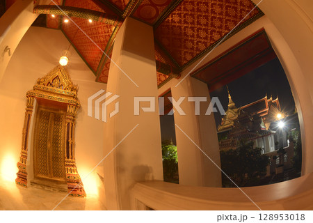 Night scene of classic Thai architecture art at Wat Phra Chetuphon or Wat Pho, one of the largest and oldest temples and a popular destination for both Thai and foreign tourists. At Bangkok city. 128953018