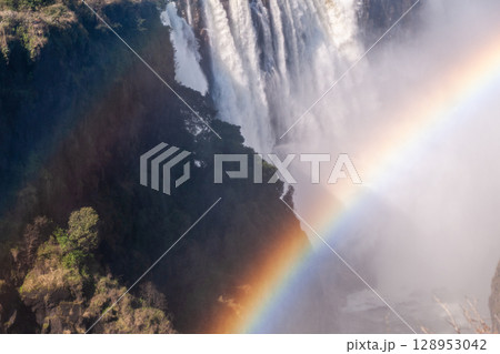 Close up of a rainbow over victoria falls Close up of a rainbow over victoria falls 128953042