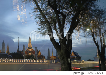 Sunset scene of beautiful lights decorate Wat Phra Kaew. This is a place of respect and tourism for Buddhists around the world Sunset scene of beautiful lights decorate Wat Phra Kaew. This is a place of respect and tourism for Buddhists around the world 128953271