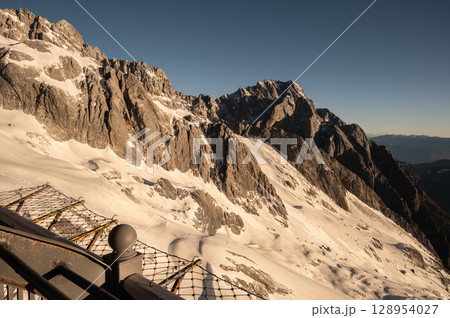 Beautiful view of Jade Dragon Snow Mountain (or Mt.Yulong) during sunrise. This mountains located in Yulong Naxi Autonomous County, Lijiang, in Yunnan province, China. 128954027