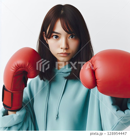 Confident Young Woman in Boxing Gloves Ready for Action with Generative AI. 128954447