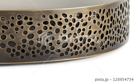 A piece of furniture with a gold finish and a pattern of holes 128954734