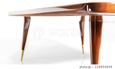 A wooden table with a gold trim and a gold base 128954839
