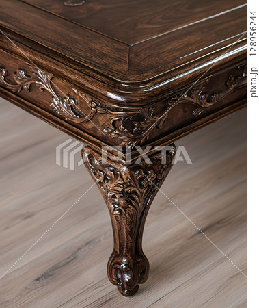 Wooden table with a floral design on the legs 128956244