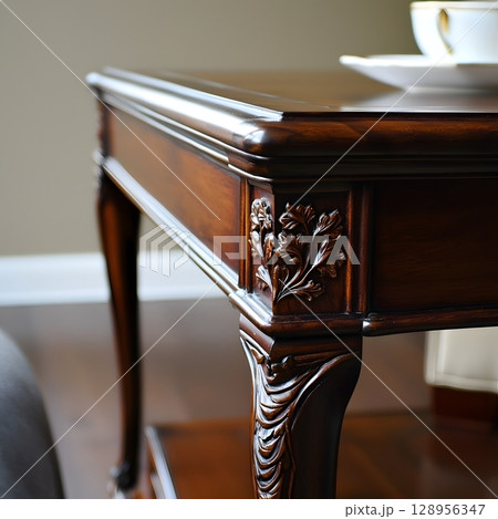 Wooden table with a floral design on the legs 128956347