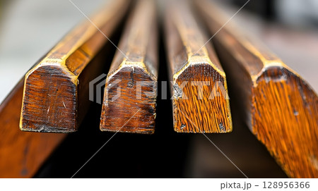 Three wooden boards with a gold trim Three wooden boards with a gold trim 128956366