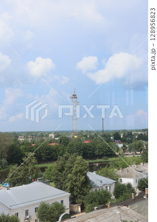 A Stunning and Scenic View of a Beautiful Landscape Featuring Buildings and a Tower 128956823