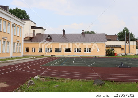 A vibrant campus with an athletic track and various sports facilities for students and community A vibrant campus with an athletic track and various sports facilities for students and community 128957202