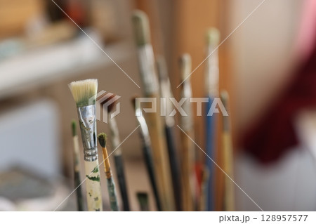 A Beautiful Collection of Artistic Brushes Perfectly Displayed in a Creative Workspace A Beautiful Collection of Artistic Brushes Perfectly Displayed in a Creative Workspace 128957577
