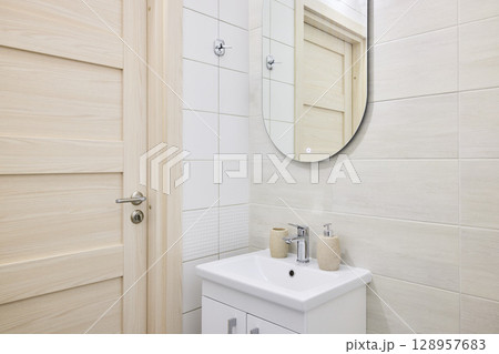 A Modern Bathroom featuring a Minimalist Design complemented by Elegant and Stylish Fixtures 128957683