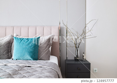 A Stylish and Contemporary Bedroom Interior Featuring Warm, Cozy Elements and Modern Design 128957777